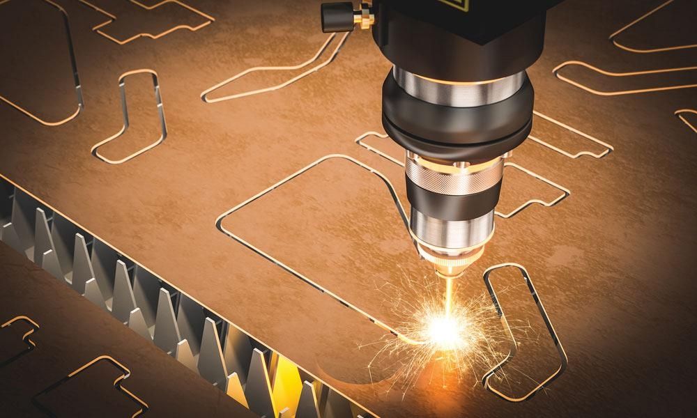 A CNC laser cutter following a programmed path through sheet metal